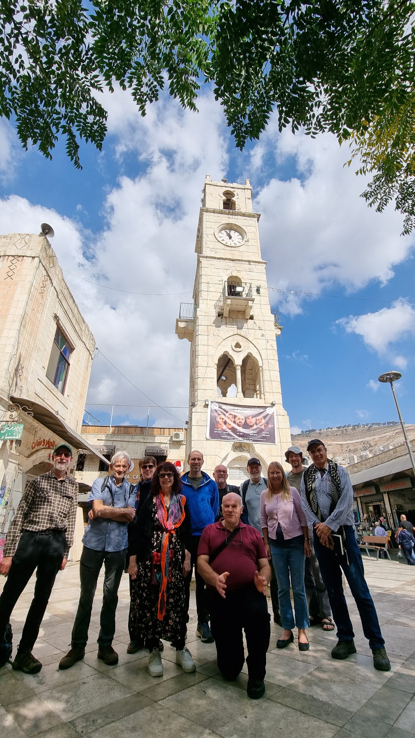 Visitors to Nablus standing in front of its clock tower